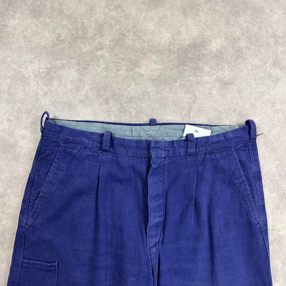 Navy blue trousers with a relaxed fit
