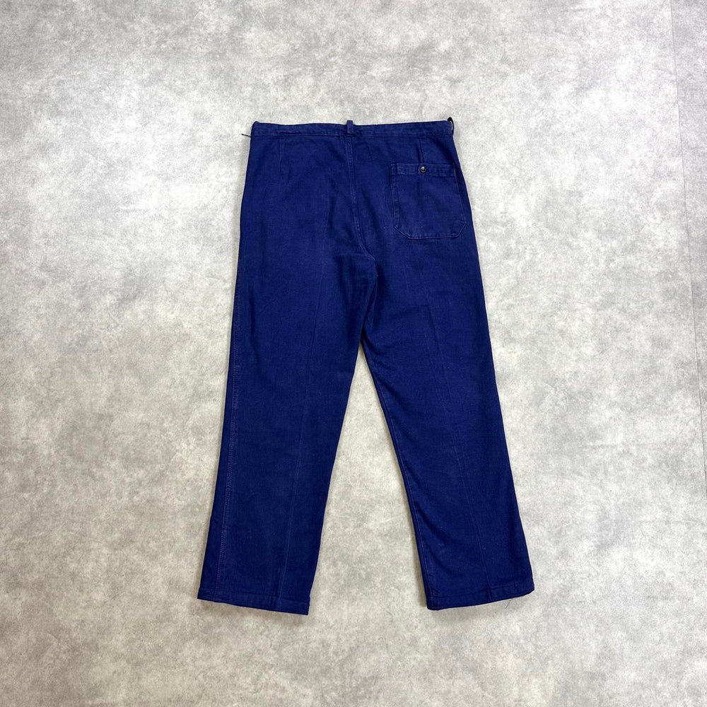 Navy blue trousers with a relaxed fit