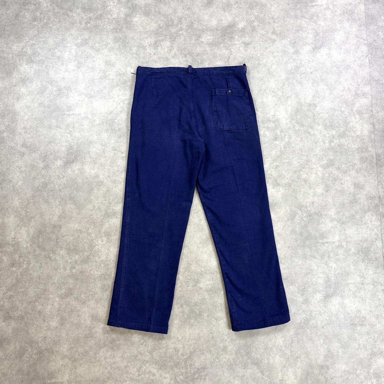 Navy blue trousers with a relaxed fit