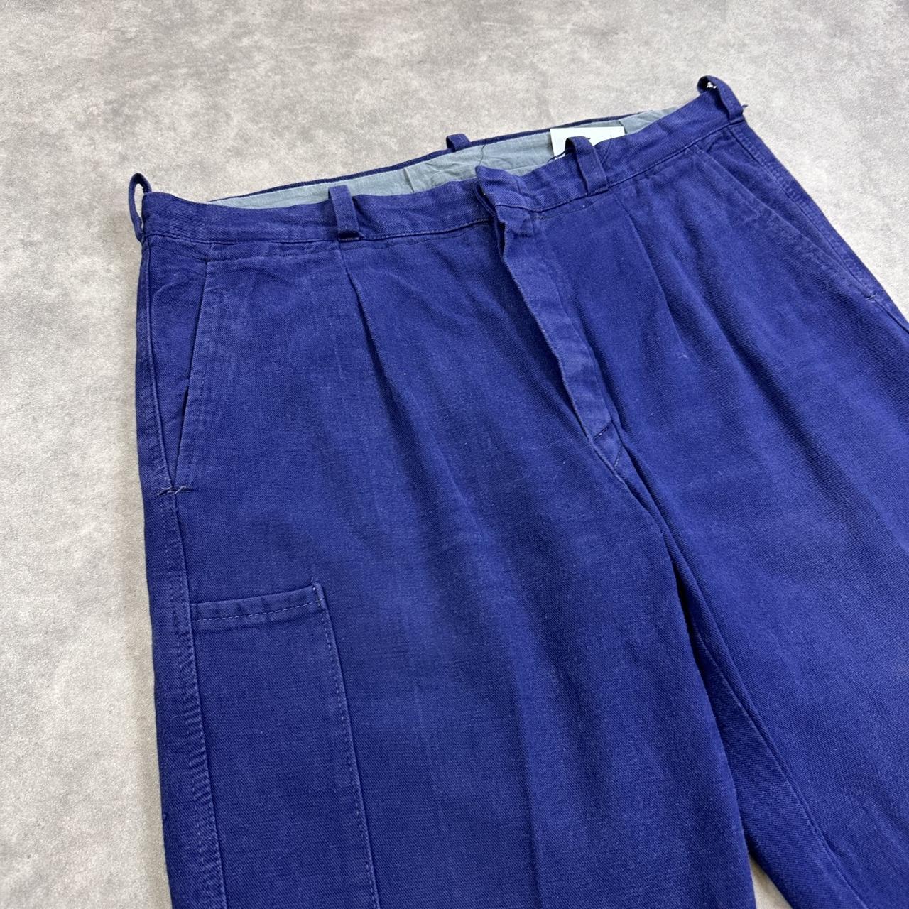 Navy blue trousers with a relaxed fit