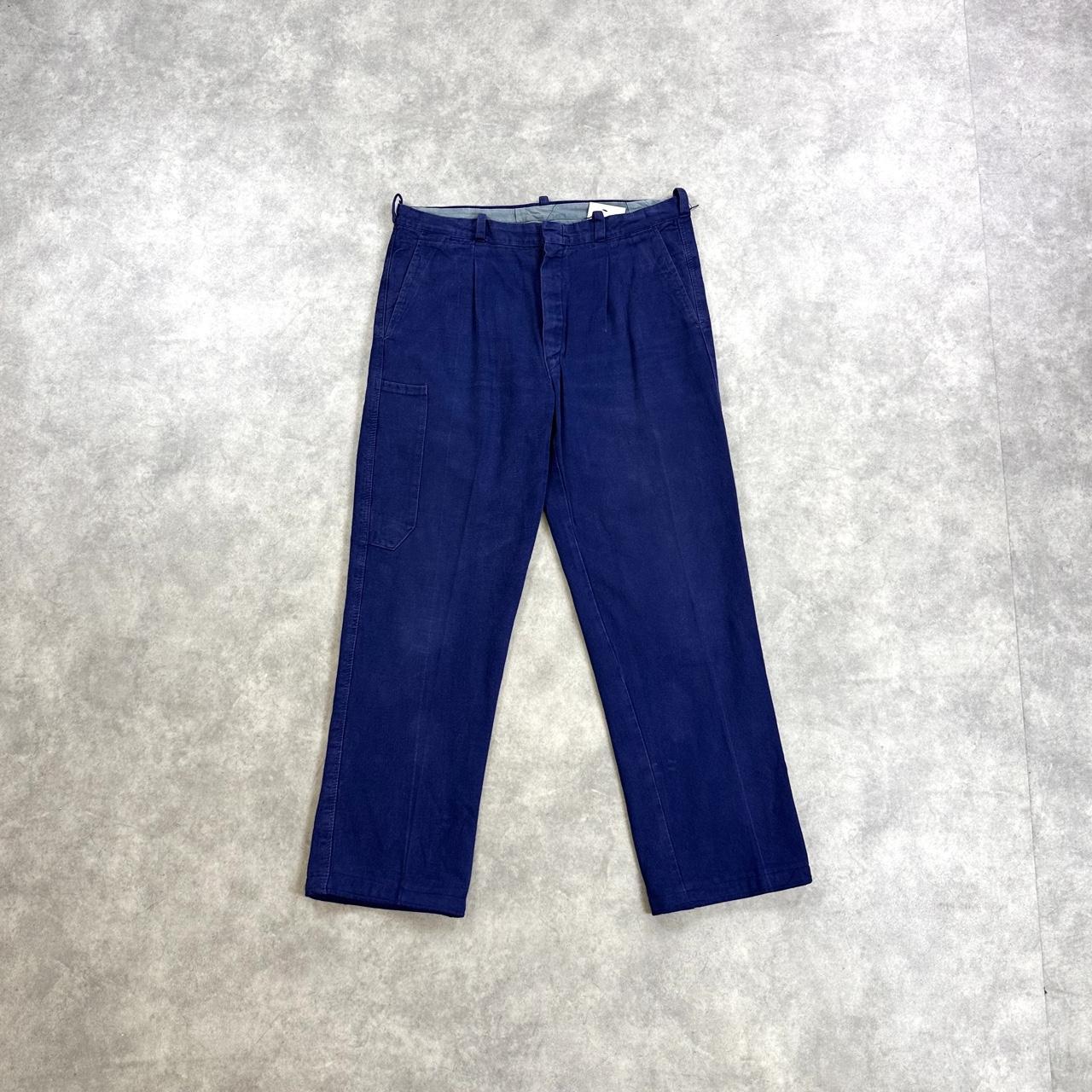 Navy blue trousers with a relaxed fit